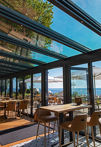 Otten Gastro Referenz Hof Sierksdorf Wintergarten Akzent Plus Glas-Faltwand Highline